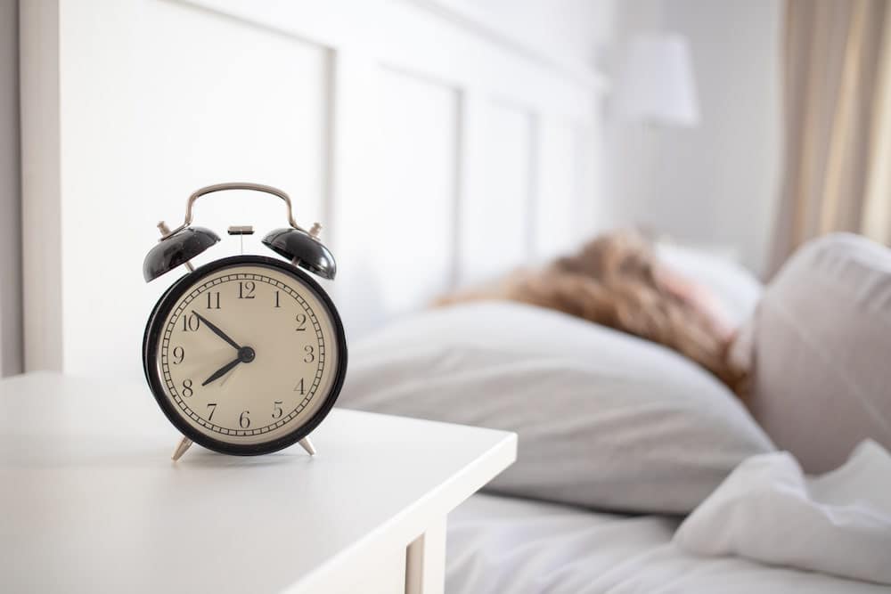 Klokke og en som sover