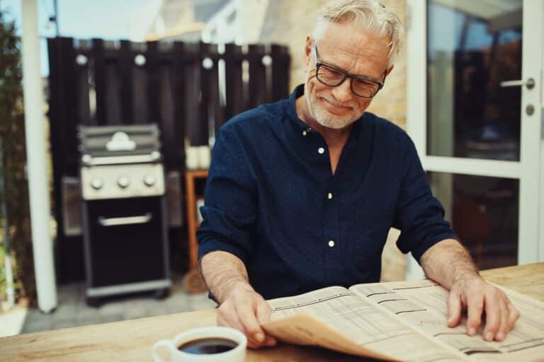 Smiling Man reading News